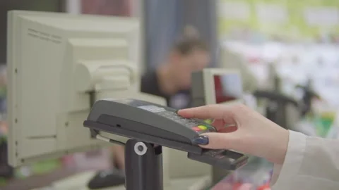 A person enters a pin code at the terminal Stock Footage 144543309