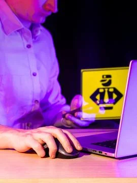 Person examining code icon overlay on desk Foto stock