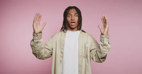 Person explains something with hand gestures against a pink background duri.. 스톡 동영상 331989746