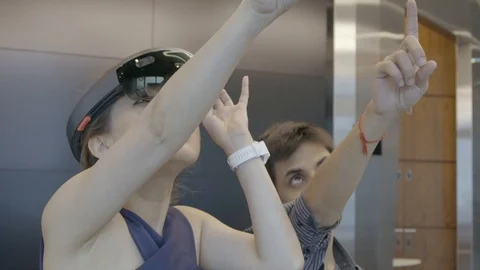 The person explains the VR experience 動画素材 126976861