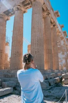 Person Exploring Ancient Stone Columns with Scaffolding Stock Photos