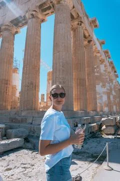 Person Exploring Ancient Stone Columns with Scaffolding Stock Photos