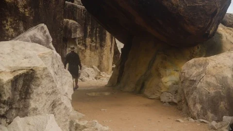 A person exploring the rock formations Stock Footage 80460322