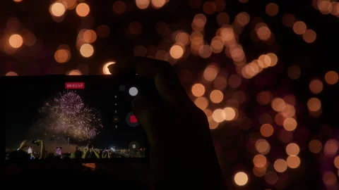 Person Filming Fireworks Display Using Cell Phone At Adachi Fireworks Festival Stock Footage 341035313