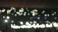 Person filming many little lights flickering in darkness at music concert HD Footage