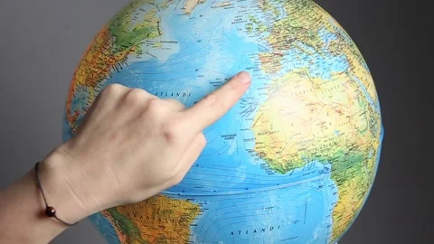 Person finger pointing out different world destinations on globe map. 스톡 동영상 148488585
