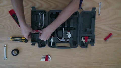 A person is fixing something with a tool Stock Footage 319393534