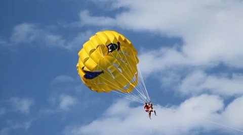 Person flies on a parachute in clouds Vídeo Stock 7734608
