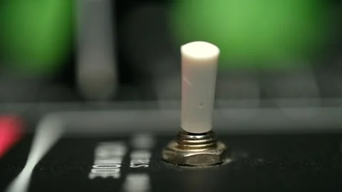 Person flipping a white toggle switch on Stock Footage 337830905