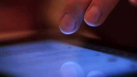 A person flips through the information on the phone with his finger Stock-Footage 111290176
