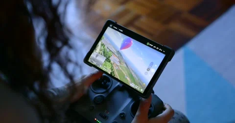 Person flying an fpv drone using a remote controller with a display Stock Footage 337509690