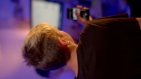 Person focused technology using a smartphone computer screen in the background Stock Footage 280431517