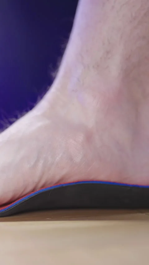 Person foot step inside the arch support insole close-up 스톡 동영상 324961083