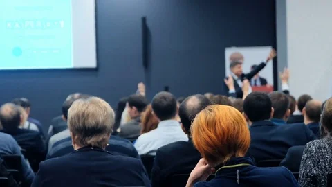 Person on the forum to solve economic issues of our time and see problem Stock-Footage 71736792
