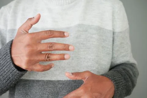 Person gestures with hands during a conversation in a room Fotos Stock