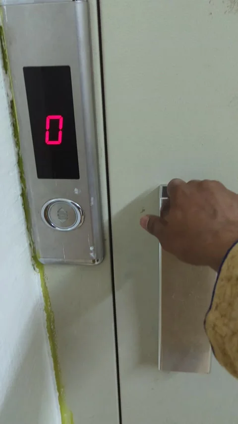 A person getting into an elevator and pressing some buttons Stock Footage 194764834