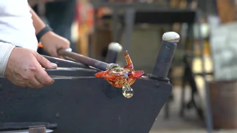Person glass blowing turtle in workshop Stock Footage 248477317