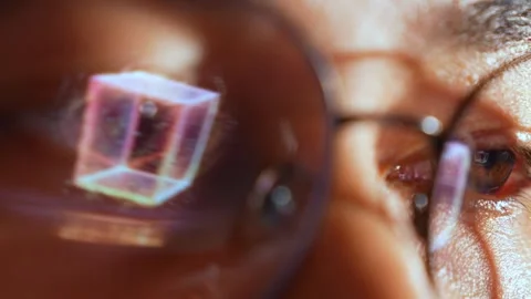 A person in glasses with a digital quantum computing cube. Stock Footage 324839452