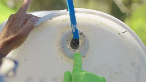 Person With Gloves Applying Silicone To The Perimeter Of Waterproof Exterior 動画素材 337041508