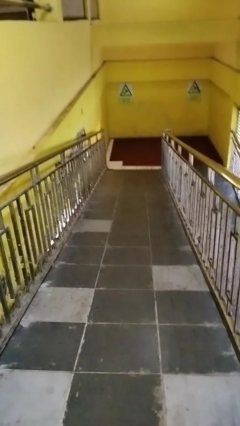 A person going down a staircase without steps Видео 330383286