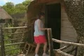 Person going into historic hut Footage