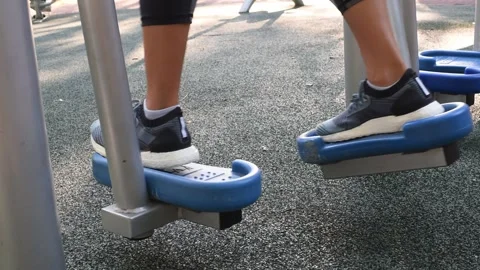 Person got up on training apparatus installed on sportsground. Stock Footage 184834388
