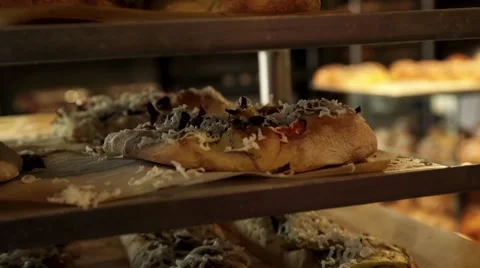 A person grabs pizza bread Stock Footage 61560316