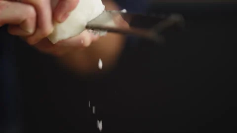 Person grating cheese closeup Stock Footage 274676267