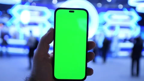 Person grips device with green display Stock Footage 344689286