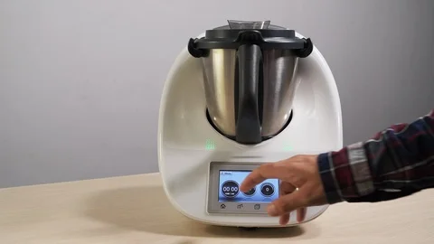 Person hand adjusts the timer on a mixer closeup to a time of one minute 4K. Stock Footage 113036924