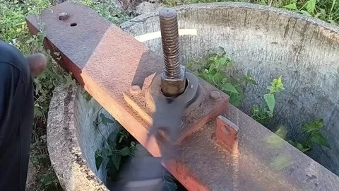 Person with Hand Disability Opening a Rusty Water Sluice Gate Valve Stock Footage 327971356