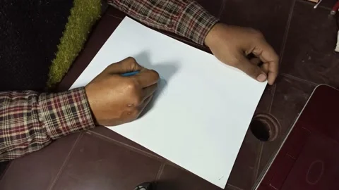 A person hand drawing on a white piece of paper Stock Footage 220623687