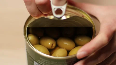 Person hand opening olive tin can and taking out olives. Close up Stock Footage 148477869