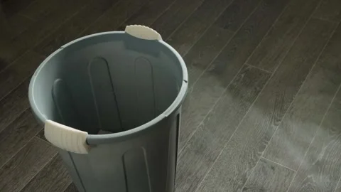Person hand removing used dust bag vacuum cleaner dropping contents into gray Stock Footage 336246742