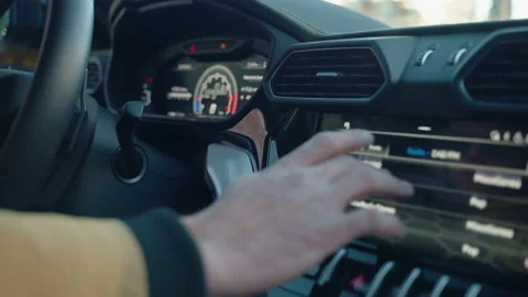 Person hand scrolling car touch screen choosing right function or adjusting 스톡 동영상 223339958
