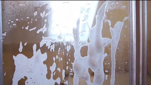 Person hand using limescale remover chemical foam. Stock-Footage 149428841