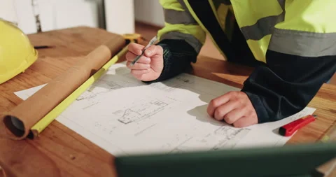 Person, hands and architect writing with blueprint for construction planning or Stock Footage 341584923