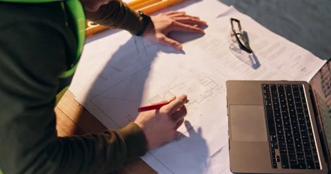 Person, hands or architect with blueprint or laptop on construction site for Stock Footage 337014266