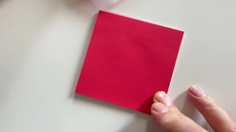 Person handwriting a romantic message on paper for Valentine day concept Stock Footage 338186465