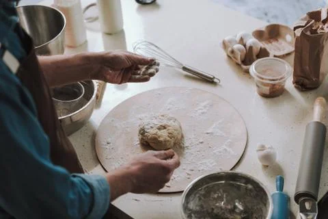 Person having dirty hands while kneading dough Stock Photos