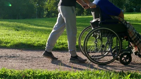 A person helping to disabled 動画素材 77860989