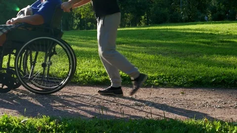 A person helping to disabled Stock Footage 77861049