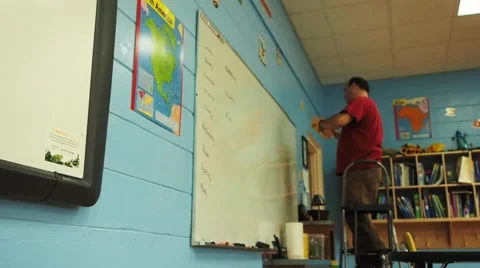 Person helping set up school classroom Stock Footage 45683953