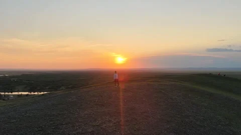 Person on Hill at Sunset in Ergun Inner Mongolia China Stock Footage 337561793