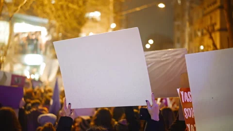 Person hold empty placard at protest demonstration. Blank banner feminism strike Stock Footage 276917985