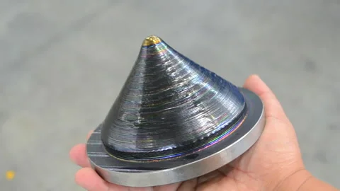 Person holding cone printed 3D printer metal Additive manufacturing solution Stock Footage 278097201