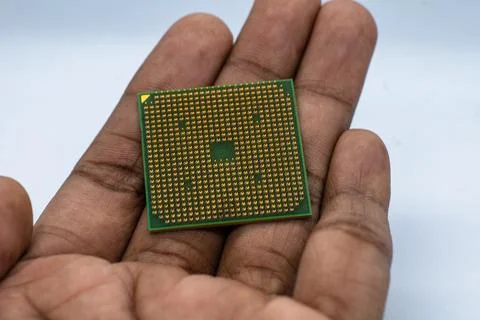 A person Holding CPU processor in hand white background, Stock Photo 写真素材