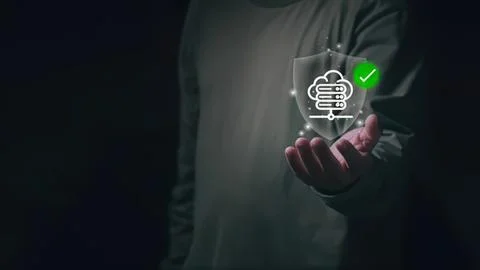 Person holding digital shield with cloud security icon Stock Photos
