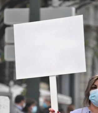 Person holding a empty sign in a protest Stock Photos