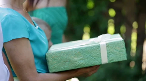 Person holding green gift Stock Footage